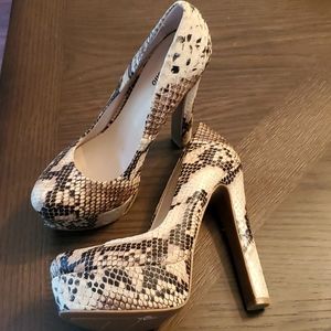 Snakeskin platform pumps